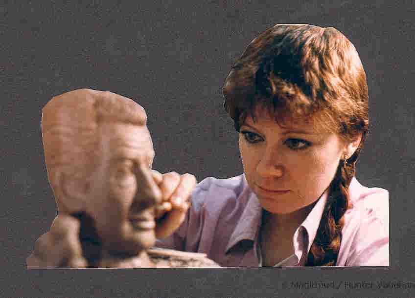 Artist Lois Vaughan working on the mug