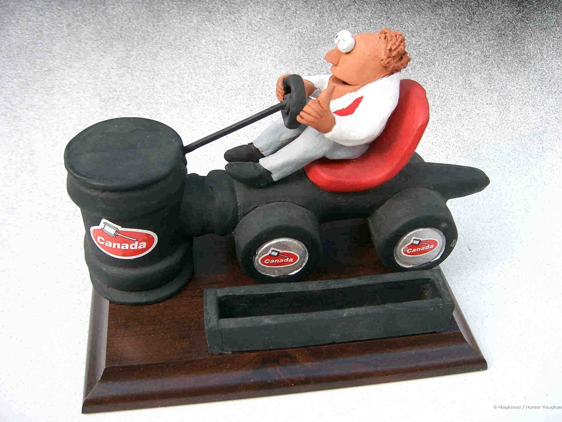 Man driving "auction gavel mobile" One of 500 Personalized Business Card Holders models made for Canada's top auto auctioneers