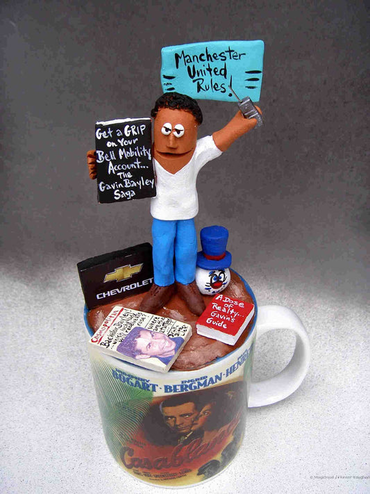 custom figurine...He's on top of his coffee, with his personal items