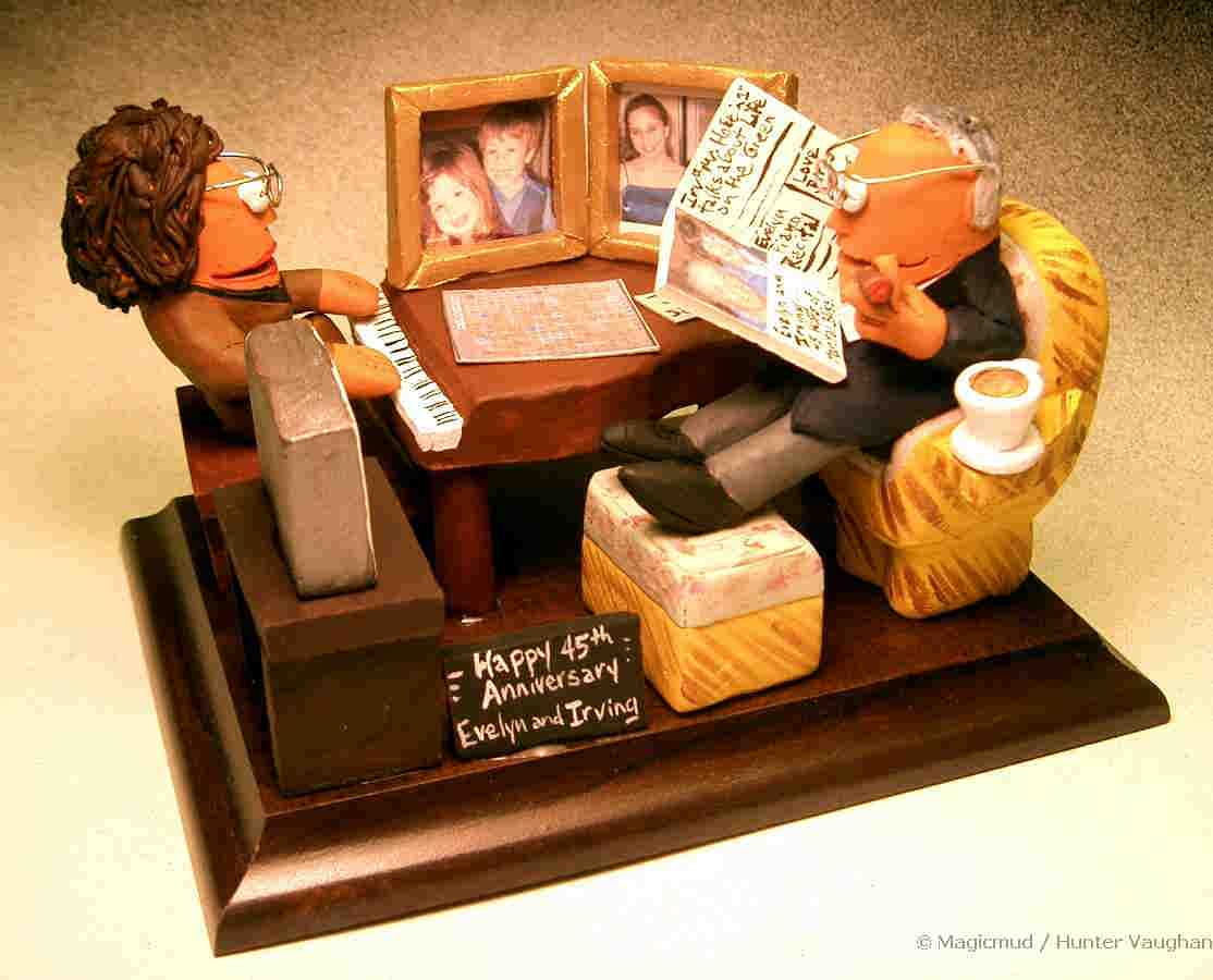 Anniversary Statue with her at the piano and him reading the paper in his easy chair, cigar in hand....Ahhhh...the good life!