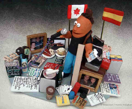 Clay Caricature of the Birthday Boy with his favorite foods, cards, music, national flags,and too many items to mention!! How many details can go into a figurine?!