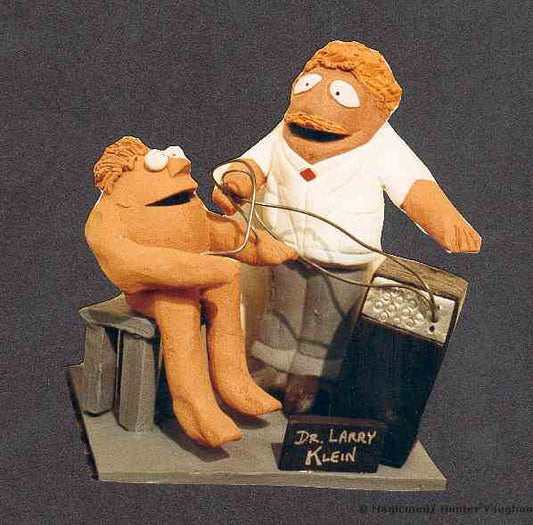 Clay caricature of Doctor in action