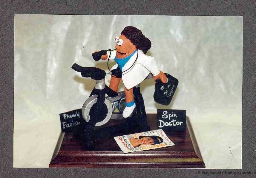 Medical statue of female doctor with her stethescope at the ready, while spinning on her workout bike. A great Doctore's Gift! and