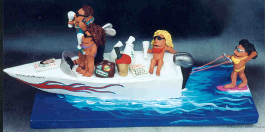 Personalized sports figurine of Mr. Cool in his yacht wearing a gold chain and shades, and his "babe" is sporting a big diamond while cruisin' in their yacht...the Good Life...Immortalized!